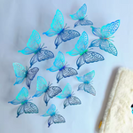 of 12 paper butterfly wall decorations in three sizes