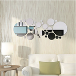 Round mirror wall stickers arranged as a decorative accent on an interior wall