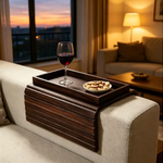 Bamboo sofa tray holding a remote control and other everyday essentials.