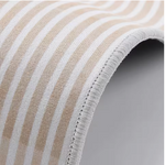 Close-up of the non-slip rubber backing on a crystal velvet area rug.