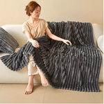 Soft flannel blanket arranged on a bed for everyday comfort.