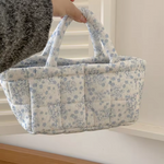 Decorative flower-pattern storage basket for organizing household essentials.